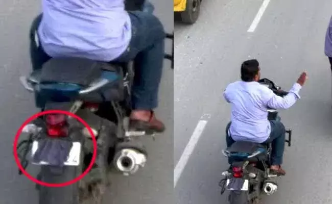 బైక్‌కు చలానా పడకుండా నెంబర్ ప్లేట్ కి బట్ట అడ్డం పెట్టాడు!