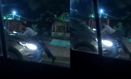 అర్ధరాత్రి ఎంపీ కారు హల్ చల్... బానెట్ పై ఓ వ్యక్తిని వేళాడదీసి..